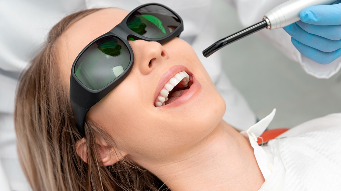 Woman Receiving Laser Dental Procedure