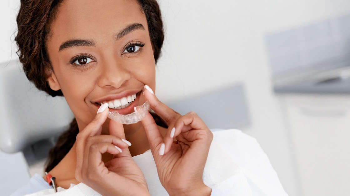 Smiling Young Woman with Clear Aligner