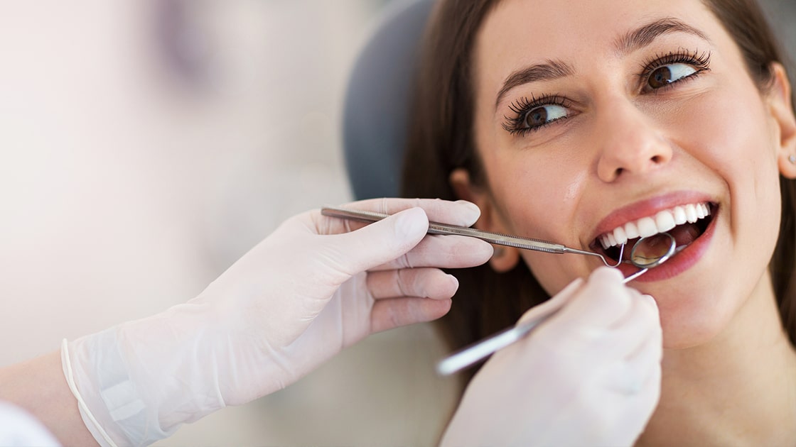 Woman Receiving a Dental Cleaning Photo